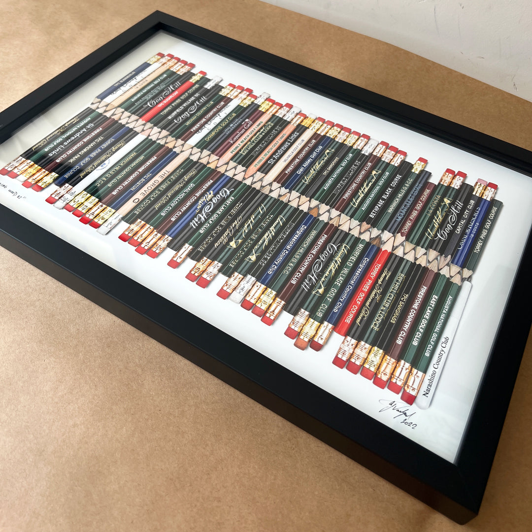 A framed golf art piece featuring a collection of golf pencils from all the 82 golf courses Tiger Woods won on the PGA TOUR. 