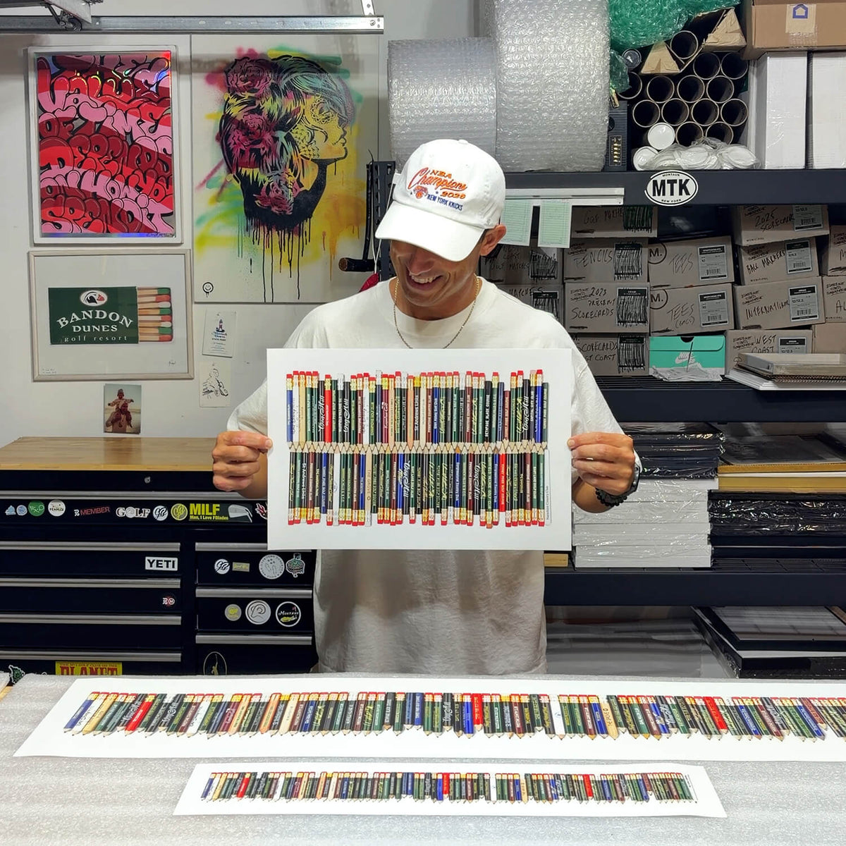 A fine art piece featuring a collection of golf pencils from all the golf courses Tiger Woods won on the PGA TOUR. 